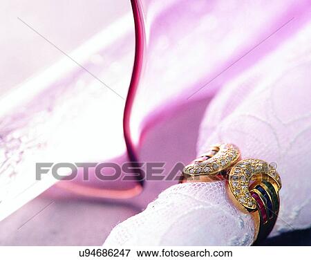 Stock Photo - Color images, close-up, jewelry, luxury, gems, diamonds, ring. Fotosearch