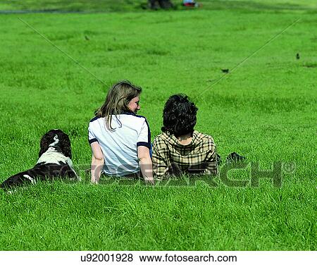 companionship, couples, outdoors, grass, relaxing, sitting View Large Photo Image Stock Photo - companionship, couples, outdoors, grass, relaxing, sitting. Fotosearch