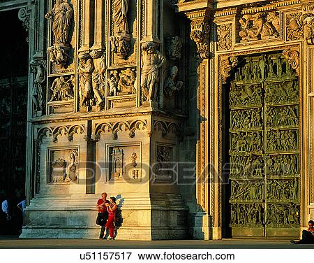 Stock Photo - couples, companionship, church, sunset, standing, architecture. Fotosearch
