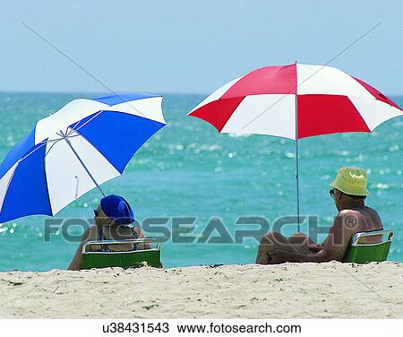 couples, companionship, elderly, outdoors, beach, umbrellas View Large Photo Image Stock Image - couples, companionship, elderly, outdoors, beach, umbrellas. Fotosearch