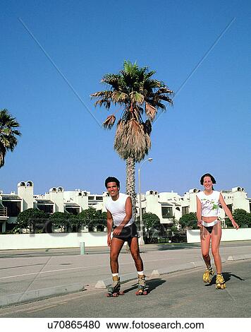 Stock Image - couples, companionship, outdoors, roller-skating, smiling, love. Fotosearch
