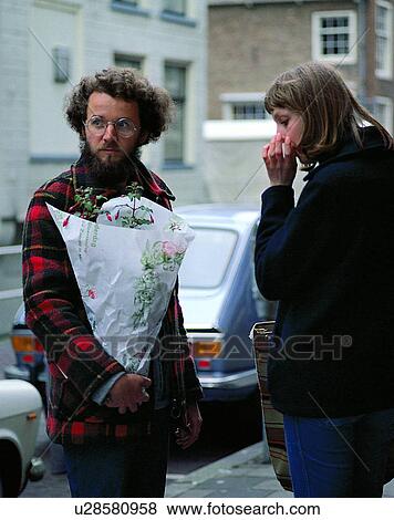 Stock Photo - couples, friends, outdoors, standing, flowers, beard. Fotosearch