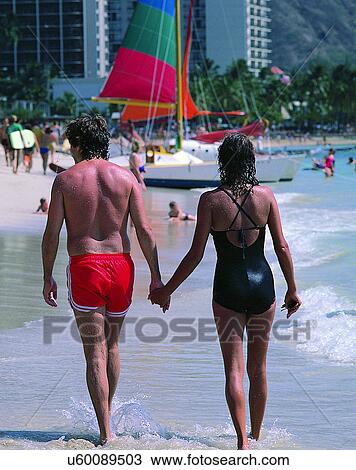 Stock Image - couples, love, companionship, outdoors, beach, walking. Fotosearch