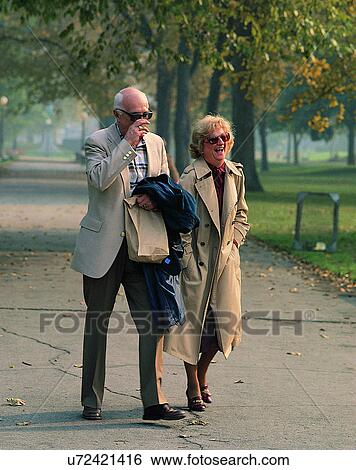 Stock Photograph - couples, love, friendship, elderly, outdoors, park. Fotosearch