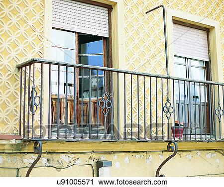 Stock Image - dog, outdoors, sitting, looking, hidden, windows. Fotosearch