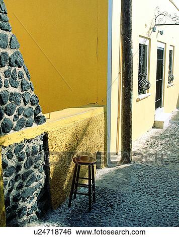 Stock Photograph - doorway, outdoors, stool, wall, alley, Aegean sea. Fotosearch
