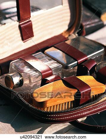 Stock Image - Europe, close-up, leather case, brush, bottle, metal. Fotosearch