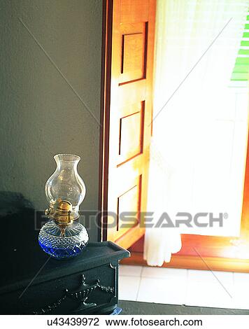 Stock Image - Europe, indoors, lamp, table, door, step. Fotosearch