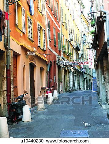 Stock Image - Europe, outdoors, streets, alley, scooter, pigeon. Fotosearch