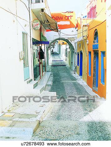 Stock Image - Europe, outdoors, streets, alley, arches, signs. Fotosearch
