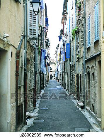 Stock Photo - Europe, outdoors, streets, alley, lamps, windows. Fotosearch