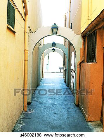 Europe, outdoors, streets, alley, arches, lamps View Large Photo Image Stock Photo - Europe, outdoors, streets, alley, arches, lamps. Fotosearch