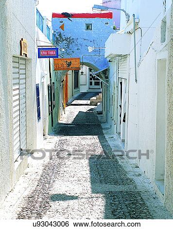 Stock Photograph - Europe, outdoors, streets, alley, shadows, signs. Fotosearch