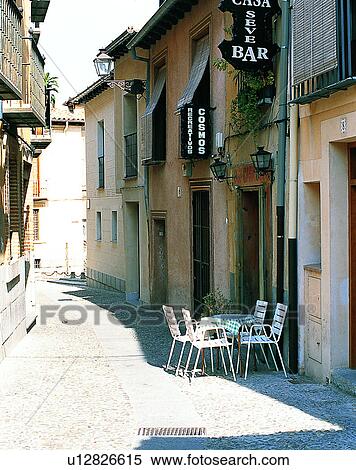 Stock Photography - Europe, outdoors, streets, alley, chairs, table. Fotosearch