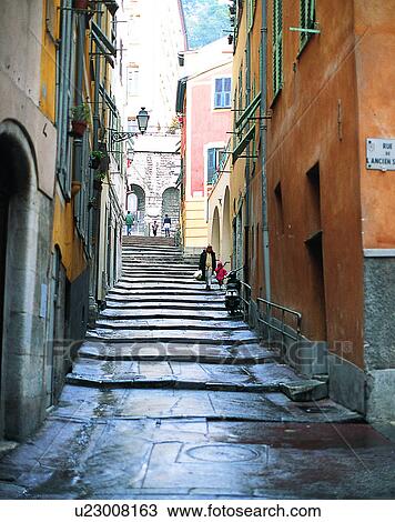 Stock Image - Europe, outdoors, streets, uphill, steps, people. Fotosearch