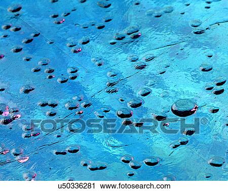 Stock Image - glass, close-up, water, drop, blue. Fotosearch