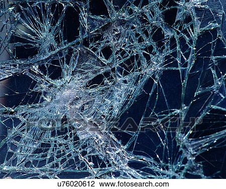 Stock Image - glass, close-up, window, cracks, broken. Fotosearch