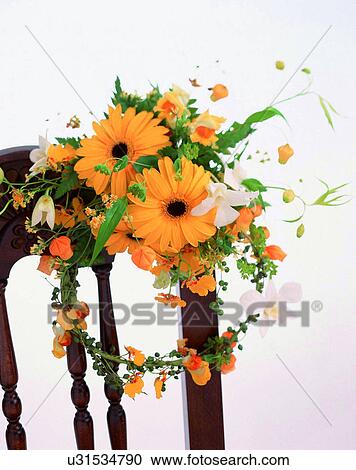 Stock Image - indoors, bouquet, flowers, close-up, yellow, chair. Fotosearch