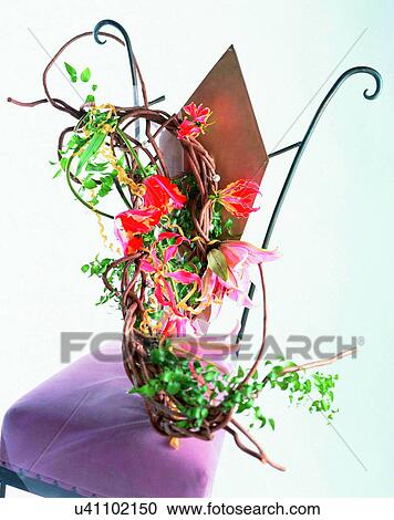Stock Image - indoors, bouquet, flowers, close-up, red, chair. Fotosearch