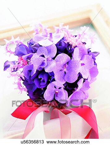 Stock Image - indoors, bouquet, flowers, close-up, purple, ribbon. Fotosearch
