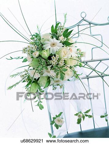 Stock Image - indoors, bouquet, flowers, close-up, chair, white. Fotosearch