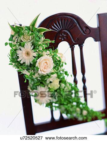 Stock Photo - indoors, bouquet, flowers, close-up, chair, leaves. Fotosearch