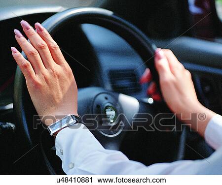 indoors, woman, fingers, car, driving, steering wheel View Large Photo Image Stock Image - indoors, woman, fingers, car, driving, steering wheel. Fotosearch