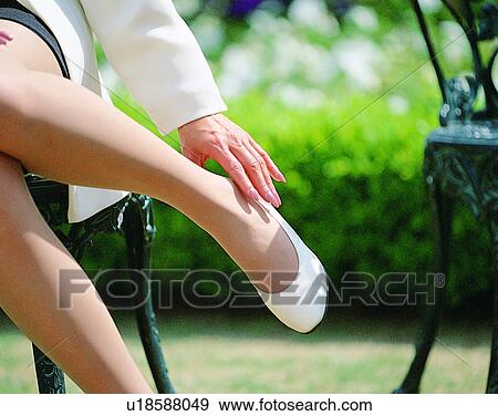 indoors, woman, fingers, hand, leg, shoe View Large Photo Image Stock Photo - indoors, woman, fingers, hand, leg, shoe. Fotosearch