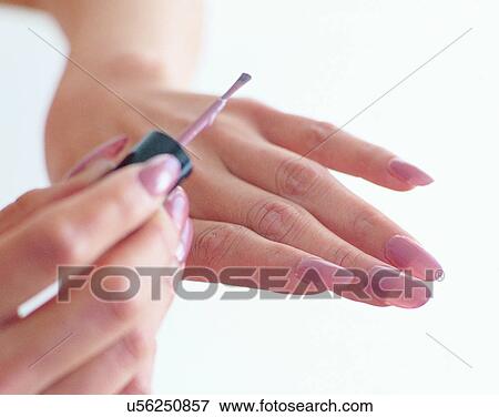 Stock Photo - indoors, woman, fingers, nails, nail paint, body part. Fotosearch