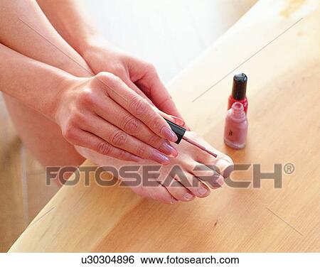 Stock Photograph - indoors, woman, fingers, nails, nail paint, body part. Fotosearch