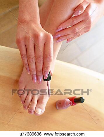 Stock Photograph - indoors, woman, fingers, nails, nail paint, body part. Fotosearch