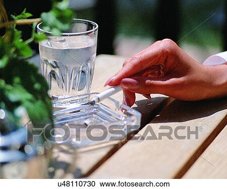 indoors, woman, fingers, smoking, cigarette, body part View Large Photo Image Stock Image - indoors, woman, fingers, smoking, cigarette, body part. Fotosearch