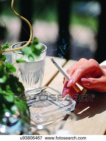 indoors, woman, fingers, smoking, cigarette, body part View Large Photo Image Stock Photo - indoors, woman, fingers, smoking, cigarette, body part. Fotosearch