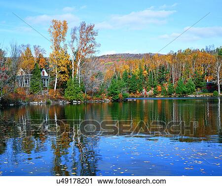 Stock Image - lakeside, water, nature, sky, mountains, landscape. Fotosearch