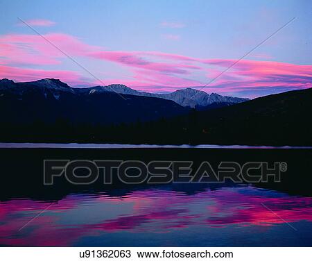 Stock Image - lakeside, water, nature, sky, mountains, landscape. Fotosearch