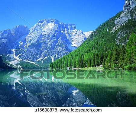 Stock Photo - lakeside, water, nature, sky, mountains, landscape. Fotosearch