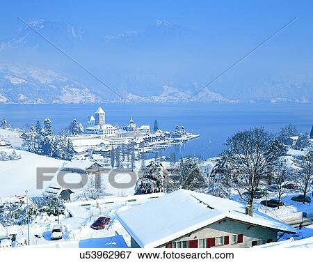 Stock Photo - lakeside, water, nature, sky, mountains, landscape. Fotosearch