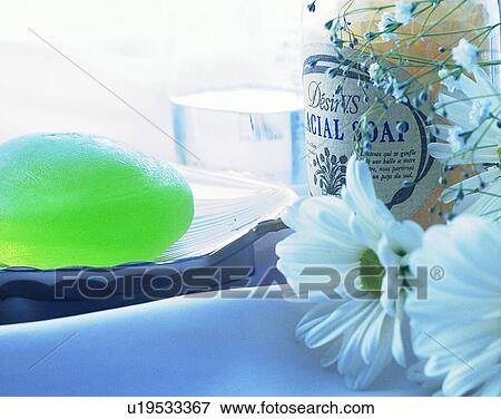 Stock Photo - lifestyle, close-up, flower, soap dish, soap, glass. Fotosearch