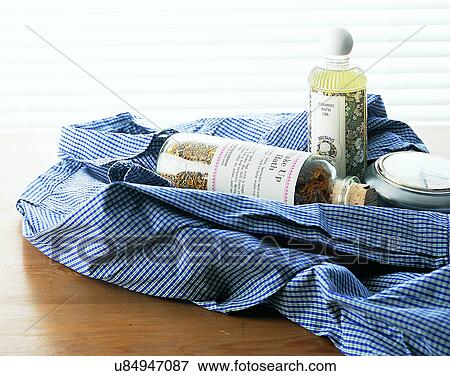 lifestyle, close-up, shirt, clock, bottles, table top View Large Photo Image Stock Photo - lifestyle, close-up, shirt, clock, bottles, table top. Fotosearch