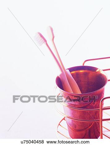 lifestyle, close-up, toilet rack, cup, toothbrushes, bright light View Large Photo Image Stock Photo - lifestyle, close-up, toilet rack, cup, toothbrushes, bright light. Fotosearch