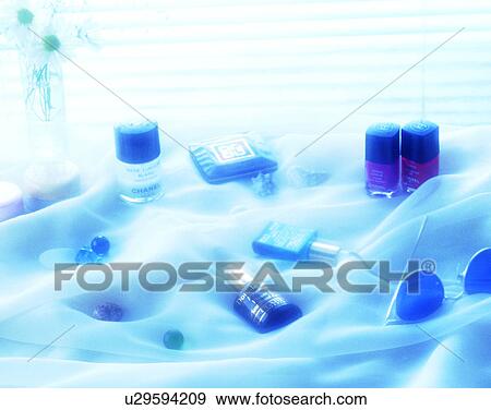 Stock Photo - lifestyle, sheet, bottles, nail polish, jewelry, glass. Fotosearch