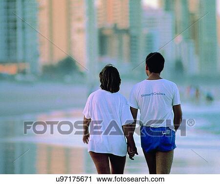 Stock Image - love, couples, companionship, outdoors, dusk, walking. Fotosearch