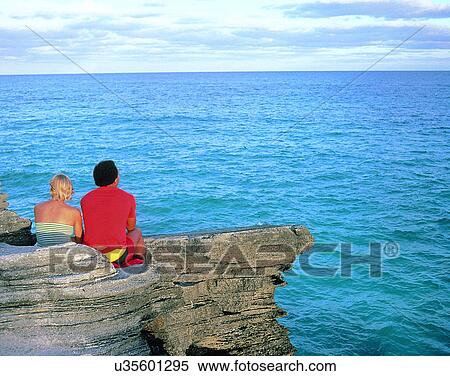Stock Photography - love, couples, companionship, outdoors, seaside, rock. Fotosearch