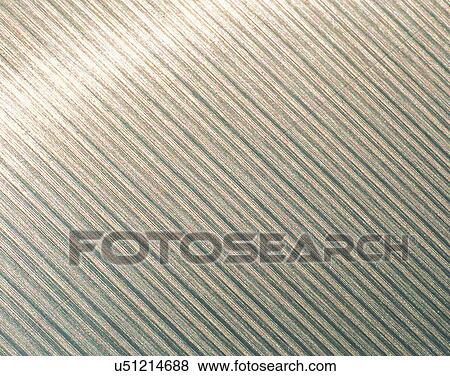 Stock Photo - metal, background, close-up, shiny, pattern, surface. Fotosearch