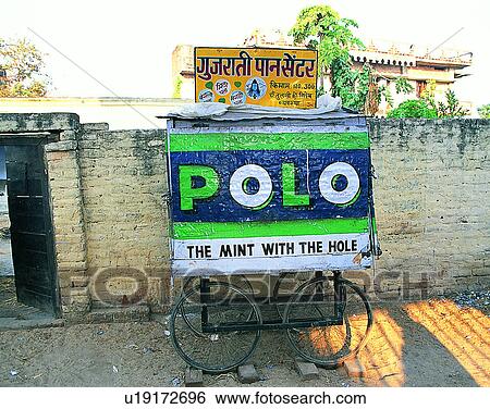 Stock Photograph - Nepal, east, cart, signs, ads, wall. Fotosearch