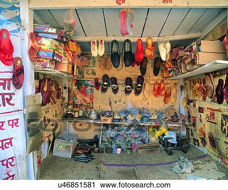 Stock Image - Nepal, east, interior, wall, shoes, ads. Fotosearch