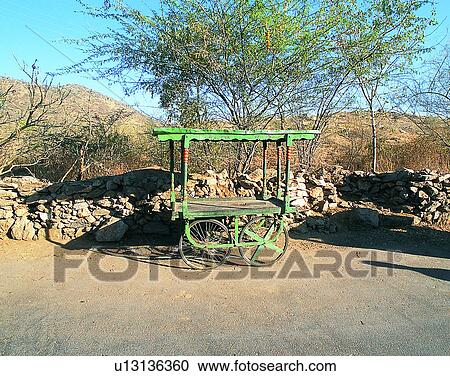Stock Image - Nepal, trees, east, wood, shadow, cart. Fotosearch