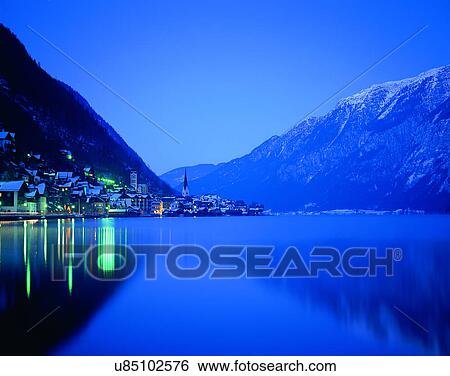Stock Photograph - outdoors, houses, river, water, night time, lights. Fotosearch