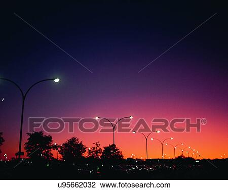 Stock Image - outdoors, night time, lights, sky, tree, evening. Fotosearch