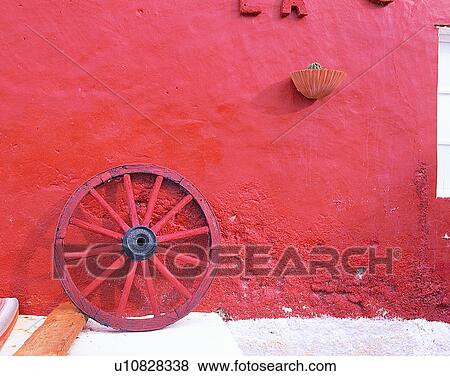 Stock Photo - outdoors, red, wheel, wall, Aegean sea. Fotosearch